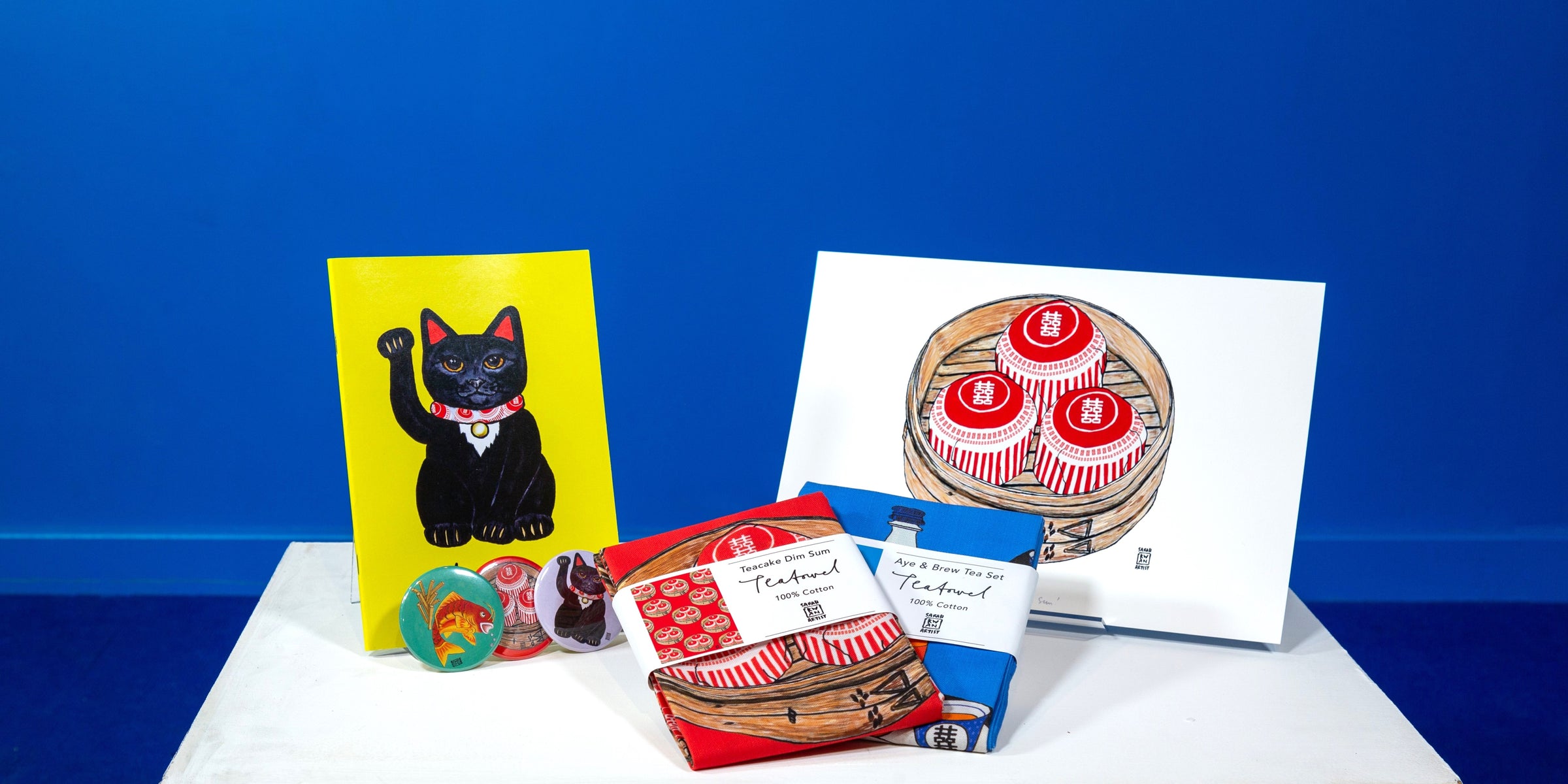 Sarah Kwan prints, tea towels, notebook and magnets