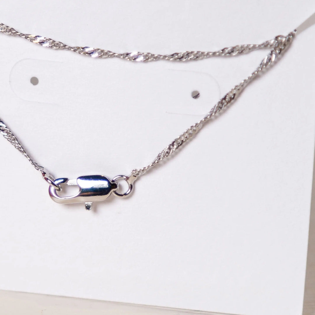 Isura - Pendant Necklace: Africa Map Outline - Migration Museum Shop